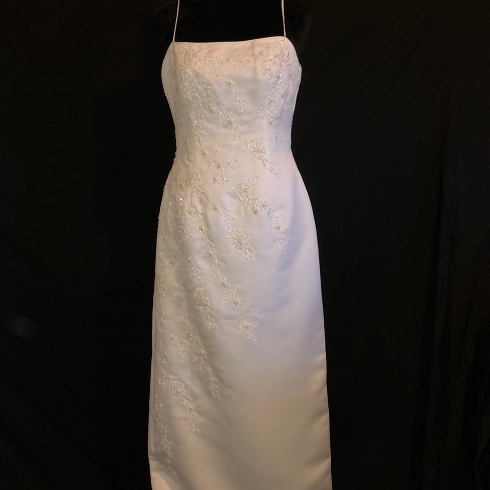 Wedding Dress, Train, and Veil by Sweetheart Gowns